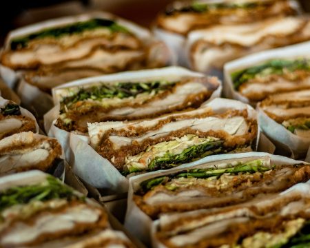 Greggs shares dip despite better trading