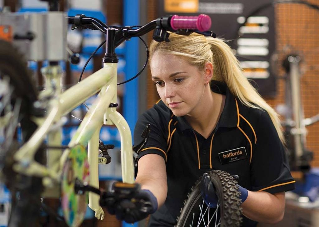 Halfords hikes profit guidance on warm weather boost